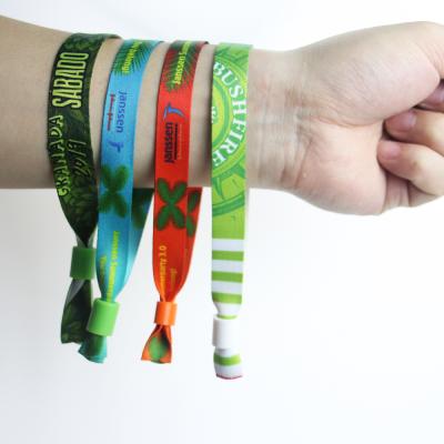 China Glowing Design Fabric Plastic Tube Free Slide Lock Custom Woven Wristband For Events for sale