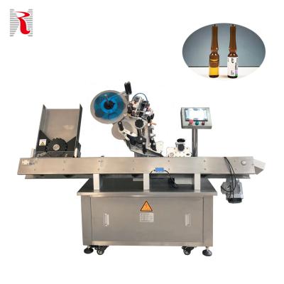 China Automatic Food Round Bottle Labeling Machine Small Ampoule Labeler for Essential Oil Vial Oral Solution Ampoule HAL-C for sale