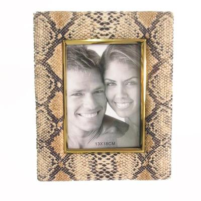 China Modern Sexy Snakeskin 5*7 Design Cloth Woodem Folding Picture Frame With Gold Metal for sale