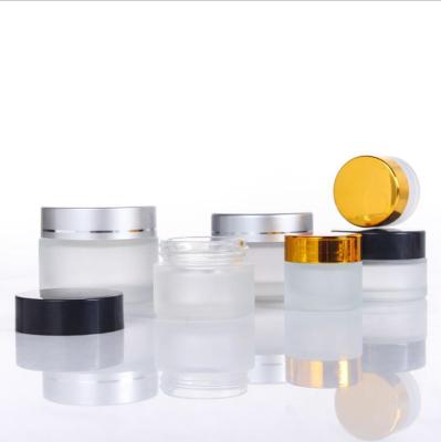 China Hot Selling Cheap Price 5g 10g 15g Personal Care Round Shape Glass Jar For Face Cream With Gold And Sliver Lid for sale