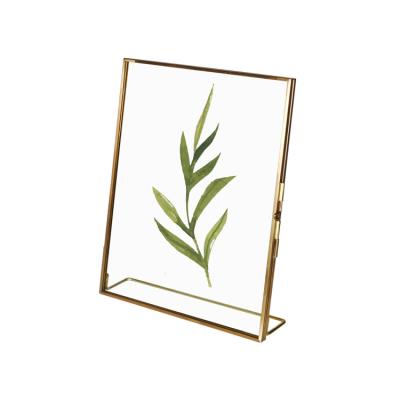 China Modern Luxury Hot Selling Creative Dry Flower Make Ornament Decorative Metal Brass Picture Frame Rose Flower Picture Photo Frame for sale