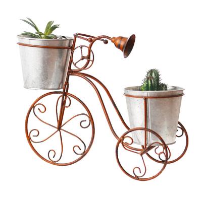 China Minimalist Antique Metal Double Layer Flower Stand Wrought Iron Bicycle Flower Pot Rack for sale