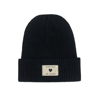 China COMMON winter warm beanies knitted custom leather label Beanie Hats Wholesale Winter Knit acrylic hat for women and men unisex plush for sale