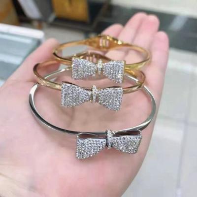 China Custom Made Bracelet CLASSIC Diamond Crystal Women Nail Charm Gold Bowknot Bangle Gold Plated Bracelet for sale