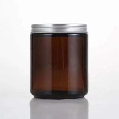 China Home Decoration 8.8oz Luxur Glass Candle Holders Empty Amber Candle Jar With Lid For Making 9*7.2cm Candles for sale