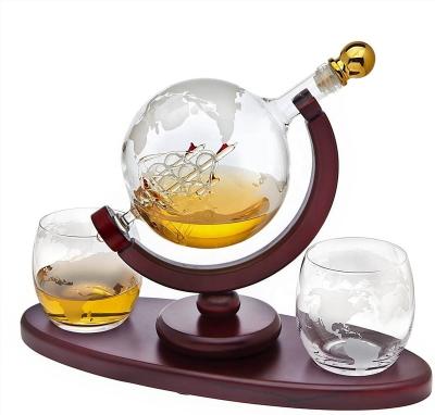 China Hot Selling Handmade Whiskey Decanter Amazon Boat Design 850ML Globe Decanter With 2 Cups Inner Wood Base for sale