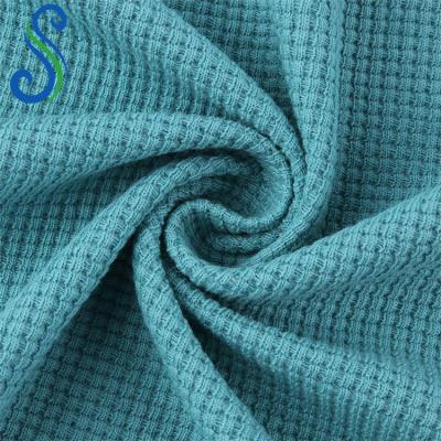 China Anti Pill Ready Goods 260Gsm 65%Cotton 35%Polyester CVC Soft Cotton Waffle Knit Fabric For Sweaters for sale