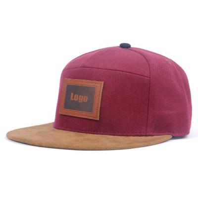 China JOINT Chic 7 Panel Snapback Cap Hat With Flat Suede Brim And Leather Patch for sale