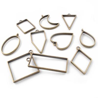 China FASHIONABLE Gold/Bronze/Silver Open White Bezel Color Geometric Frame Charms Resin Pendant Jewelry Making Bezel Mold for sale