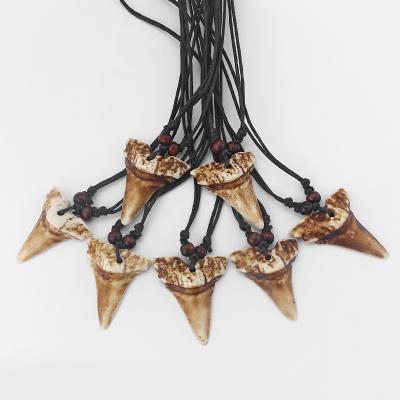 China Wholesale 12pcs Fashionable Brown Sharks Teeth Yak Bone Necklace Pendants Wax Rope for sale