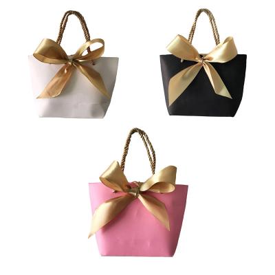 China Portable Baby Shower Favors Wrapping Paper Bag Wedding Favors Candy Handle Bags With Ribbon Baby Shower Gift Wrapping 28*9*20cm for sale