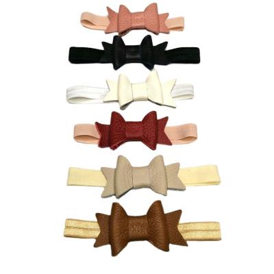 China Newborn Soft Leather Bow Baby Genuine Leather Soft Stretchy Nylon Headbands To Girls for sale