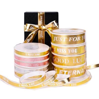 China Bowknot Stock Christmas Gold Holiday Print Silk Ribbon Cable Christmas Ribbon For Gift Wrap Super Thick 100% Cotton Ribbon for sale