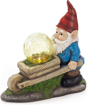 China Country Wheelbarrow Gnome With Magic Globe LED Solar Powered Outdoor Decor Resin Garden Gnome Statue for sale