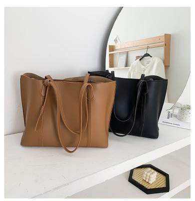 China 2021 Folding PU Large Capacity Ladies Tote Bag Solid Color Leisure Stylish Leather Handbag for sale