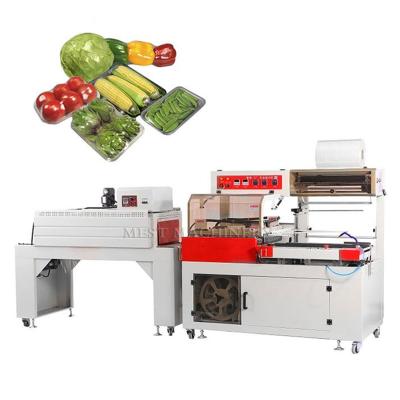 China Full Automatic Food Fresh Vegetable Tray Wrap Packing Food Over Wrapping Machinery for sale