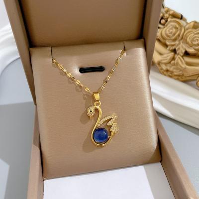 China Blue Healing Gold Plated Swan Necklace Fashionable Women Jewelry Color Changing Stone Titanium Steel Pendant for sale