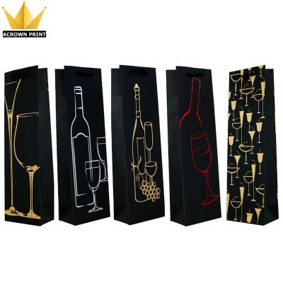 China Recyclable Foil Stamping Luxury Black Logo Paper Bag Christmas Gift Bottle Wine Bags for sale