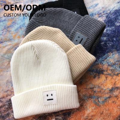 China JOINT Designer Unisex Trendy Woven Label Knitted Winter Beanie Hat Running Warm Beanies With Custom Logo Hat for sale