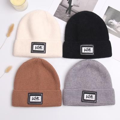 China Fashion JOINT Warm Casual Couples High Quality Selling Winter Warm Hats Letter Love Letter Patch Beanies Soft Knitted Hat for sale