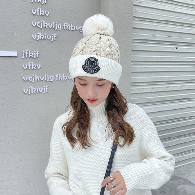 China Latest Winter Brand Women COMMON Chunky Beanie Ski Cap Soft Warm Knitted Hats With Pompom for sale