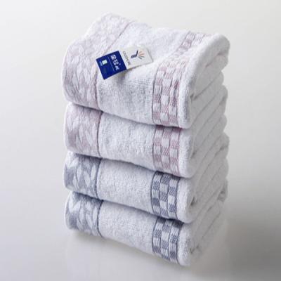 China 72*34cm Pure Cotton simple classic grid face towel embroidered hand towel with satin for sale