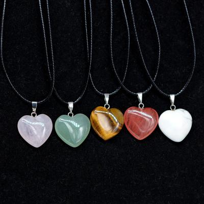 China Hot-selling natural stone new turquoise color ware natural stone crystal heart cord leather necklace peach heart shaped stone pendant for sale