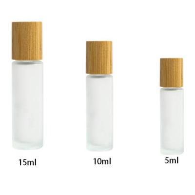 China Big Frost 15ML Cosmetic Empty Roll On Oil Bottle Frosted Glass Perfume Bottle With Bamboo Lid for sale