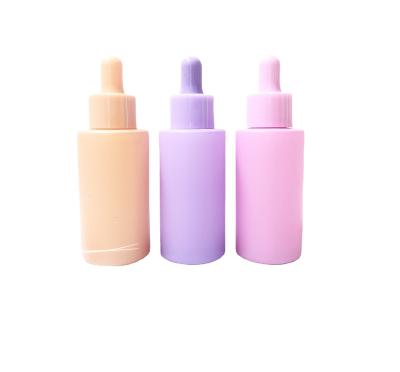 China Beauty industry hot sale pink color 30ML 40ML flat shoulder frosted glass dropper bottle for sale