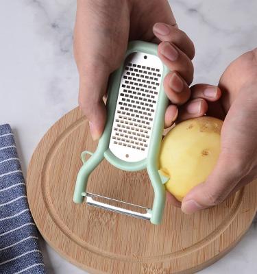 China Innovative Design Viable Hot Selling Multifunctional Peeler, Grater and Slicer with Fruit and Vegetable Cover Peeler for Potato, Carrot for sale