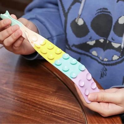 China New fidgety person toys for kid Multifunctional Squidopop Squishy Push Squeeze Relax Silicone Squish Pull it fidgety person toy for sale