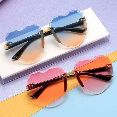 China Fashion sunglasses 2022 cute kids designer sunglasses girls kids shape sunglasses rimless heart-shaped sunglasses for sale