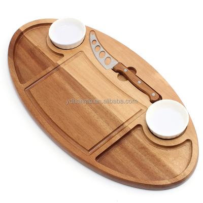 China Factory Sustainable High Grade Oval Acacia Cheese Board And Knife With Ceramic Dish And Juice Groove Acacia Wood Cutting Board Kitchen for sale