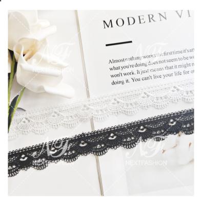 China Viable Wholesale White Black White Black Lace Fabric Polyester Apparel Chemical Milk Silk Embroidery Lace for sale