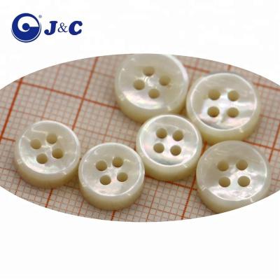 China Dry Cleaning Custom Carving Natural White Pearl Shell Button For T Shirt for sale