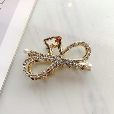 China ALLOY fashion metal hair claw cuts rhinestone sliver gold claw bow hairpin hair accessories for sale