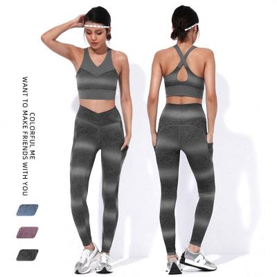 China New 2021 hot sales breathable gradient snake-print yoga suit set high waist pocket sports tights belt chest pad printed bra two-piece sets for sale