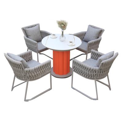 China Durable 2022 Modern Design Outdoor Table And Chairs Garden Furniture Wicker Leisure Table Set With Cushion for sale