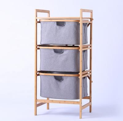 China Modern Removable Type Bamboo Dirty Storage Shelf Clothes Laundry Basket 3 Drawer 3 Compartments for sale