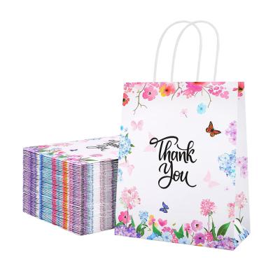 China Recycled Materials 10.6x8.2x4 Inches Purple Floral Thank You Bags Twisted Handles Kraft Paper Merchandise Bags Magazine Packaging Bag for sale