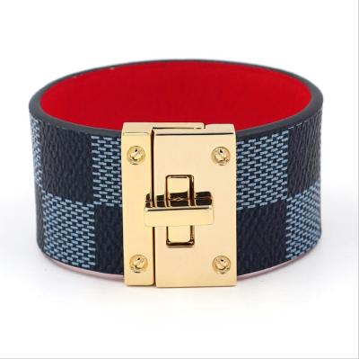 China CLASSIC News Fashion Gold Lock Women's Wide PU Leather Alloy Bracelet Striped Buckle Strap Bracelet for sale