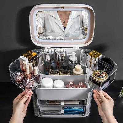 China Bedroom Mirror Makeup Waterproof Dustproof Led Storage Box Rotating Makeup Organizer Jewelry Cosmetic Storage Plastic Clear Box for sale