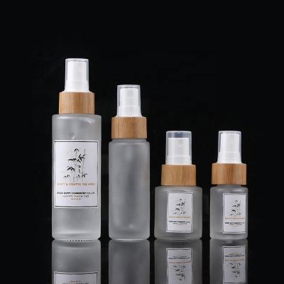 China Cosmetic 1.7 oz 50 ml empty cosmetic frosted glass bottle in stock with spray pump for sale