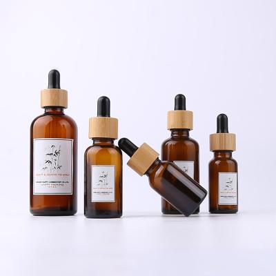 China Cosmetic 0.5 oz 15ml Amber Cosmetic Oil Dropper Glass Bottle with Bamboo Dispenser for sale