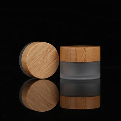 China 15g 30g 100g Cosmetic Skin Care Products Container Eco-friendly Bamboo Lid Frosted Glass Jar With Bamboo Lid Set for sale