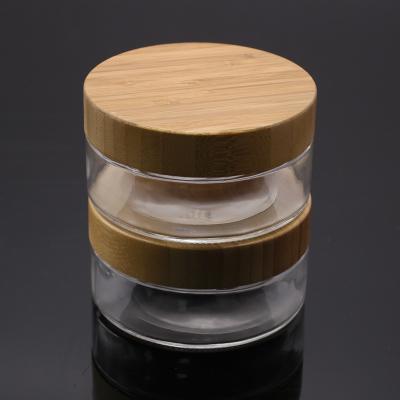 China Latest Design 100g Skin Care Products Container Empty Glass Cosmetic Jar Skin Care Cream Jar With Bamboo Cap for sale