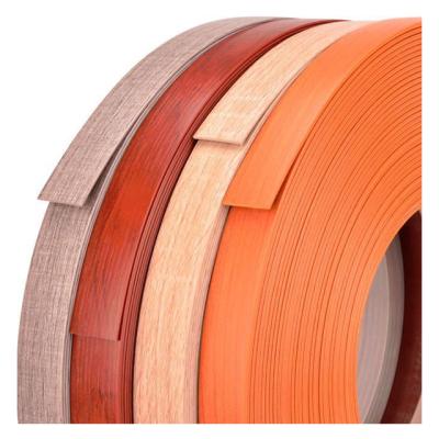 China PVC DBL Panel PVC Wood Grain Customized Edge Protection Strip Strip Furniture Pre-Gummed Dark Edging Furniture Strip PVC for sale