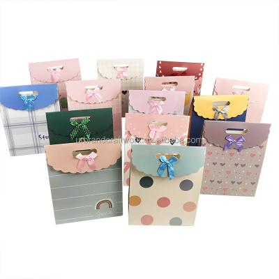 China Recycled Materials Spill Gift Box Bow Kraft Paper Gift Bag Christmas Day Candy Large Carrying Bag Creative Gift Box Bag for sale