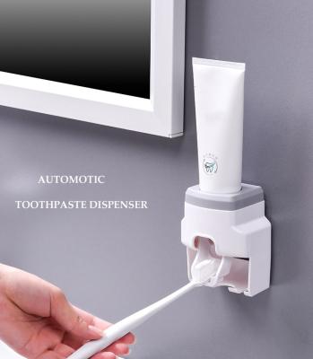 China Viable Wall Mount Toothpaste Vending Machine Lazy Squeezer Toothbrush Holder for sale