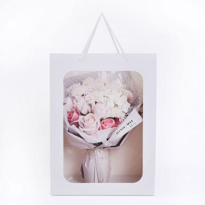 China Buying Custom Logo Rose Bouquet Flower Window Gift Bags Recyclable Transparent Doll Packaging Paper Bag Cheap Flowers Carry Paper Bag for sale